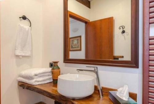a bathroom with a sink and a mirror at Villa Gallina in Barbaresco