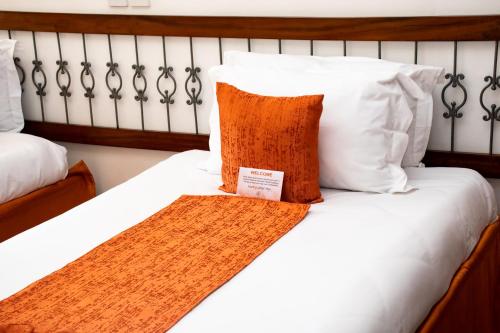 Postel nebo postele na pokoji v ubytování Hotel Boulevard Nairobi, City Centre CBD