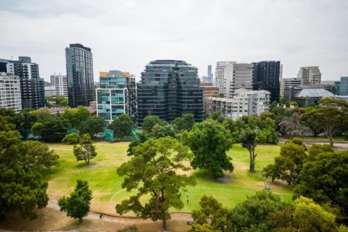 a park with trees and buildings in a city at Luxury Melbourne 4 Bed Apt - Pool and Parking in Melbourne