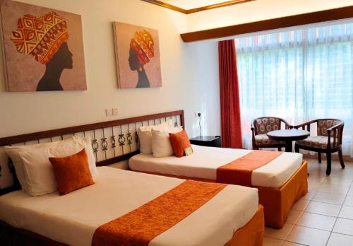 Postel nebo postele na pokoji v ubytování Hotel Boulevard Nairobi, City Centre CBD