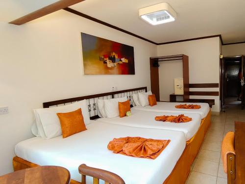 Postel nebo postele na pokoji v ubytování Hotel Boulevard Nairobi, City Centre CBD