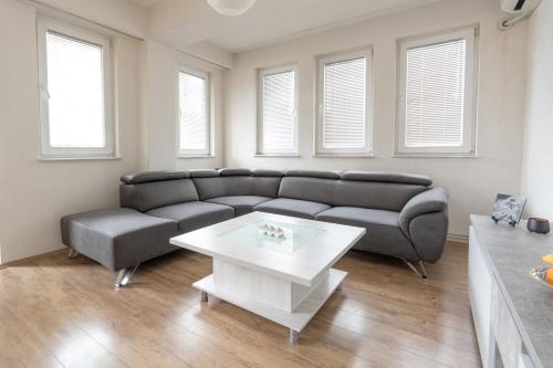 a living room with a couch and a table at Daria Apartment in Bitola in Bitola