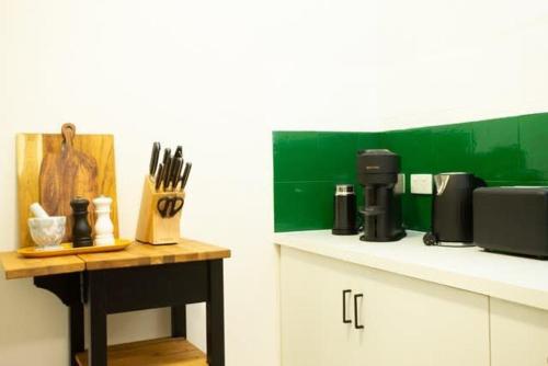 a kitchen with a counter with a coffee maker on it at Fully Renovated 1Bdr Apt in Northbridge in Perth