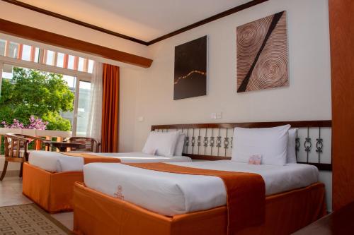 Postel nebo postele na pokoji v ubytování Hotel Boulevard Nairobi, City Centre CBD