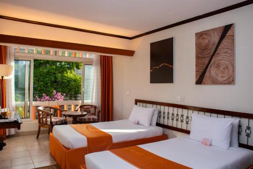 Postel nebo postele na pokoji v ubytování Hotel Boulevard Nairobi, City Centre CBD
