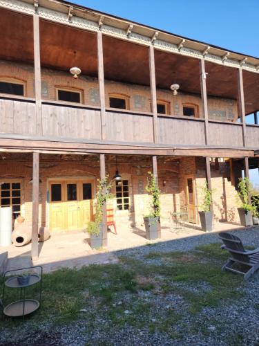 an outside view of a building with a deck at Kardanakhi Estate in Anaga