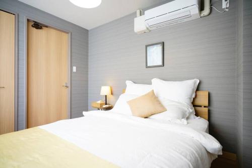 Lova arba lovos apgyvendinimo įstaigoje Condominium Riana