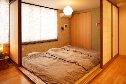 Llit o llits en una habitació de Condominium Riana