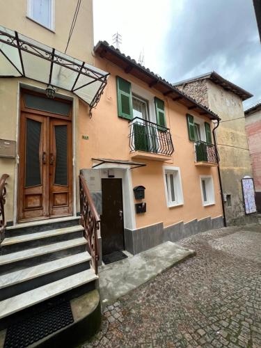 a building with a staircase leading to a door at InCentro Millesimo in Millesimo