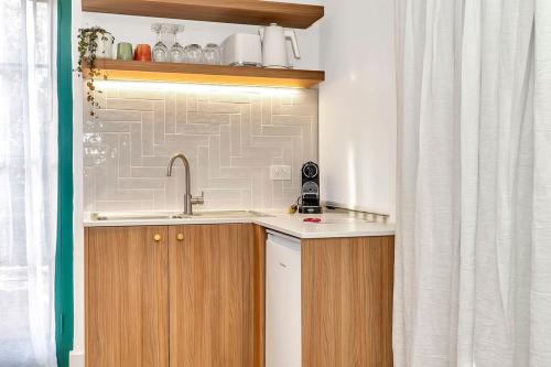 a kitchen with a sink and a shower curtain at Stirling Castle in Stirling