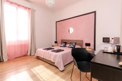 Postel nebo postele na pokoji v ubytování Pink Room