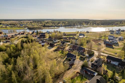 an aerial view of a village next to a river at Aidattu omakotitalo - Palju lisämaksusta in Kalajoki