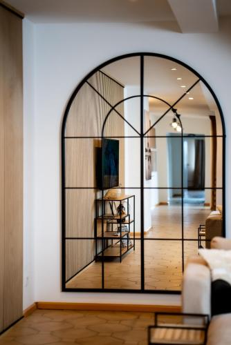a room with a large glass window in a living room at Boutique Apartment Niederrhein in Friedrichsfeld