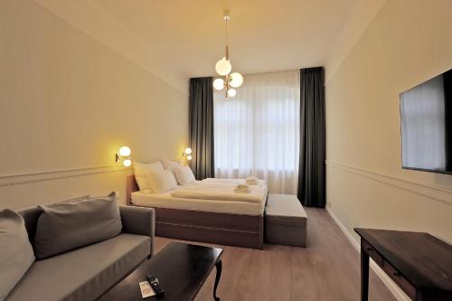 Postel nebo postele na pokoji v ubytování Kavalír Apartments