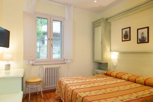 Postel nebo postele na pokoji v ubytování Hotel Minerva