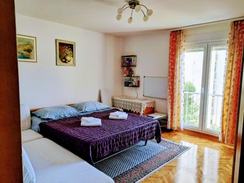 Un pat sau paturi într-o cameră la Apartment Vlatka