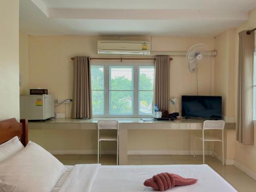Ένα ή περισσότερα κρεβάτια σε δωμάτιο στο Baan Baramee House