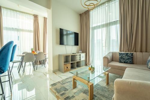 a living room with a couch and a table at AWS Holiday Homes - Luxurious 2BR in Business Bay in Dubai