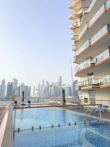 a swimming pool on the roof of a building at AWS Holiday Homes - Luxurious 2BR in Business Bay in Dubai