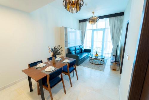 a living room with a table and chairs and a couch at AWS Homes - Supreme Retreat in Business Bay in Dubai