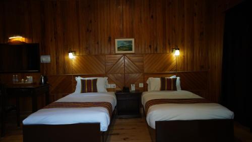 Ein Bett oder Betten in einem Zimmer der Unterkunft Hotel Olathang