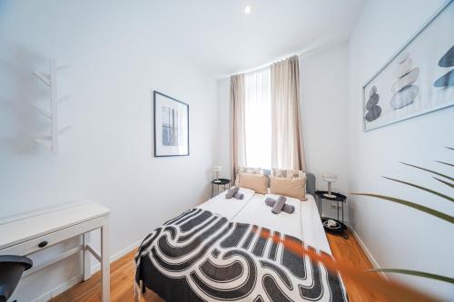 a bedroom with a bed with a zebra blanket on it at Nice Central City Room in Vienna