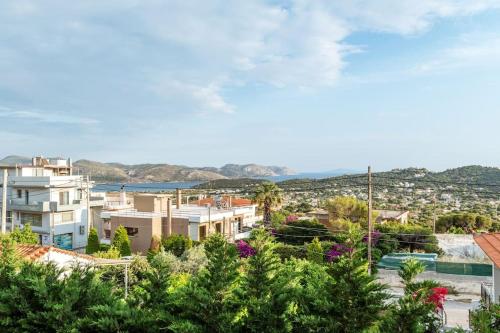 a view of a city with houses and trees at Luxe Seaside Anavissos- Athens, 3 Bedroom,Jacuzzi in Anavissos