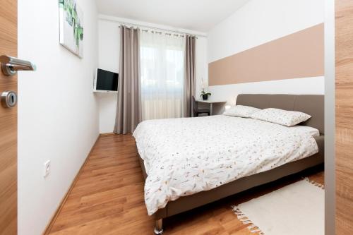 Ένα ή περισσότερα κρεβάτια σε δωμάτιο στο Apartments Euphemia