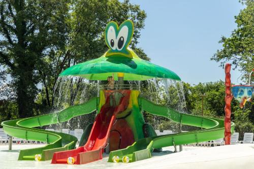 a water park with a water slide at hu I Pini village in Fiano Romano