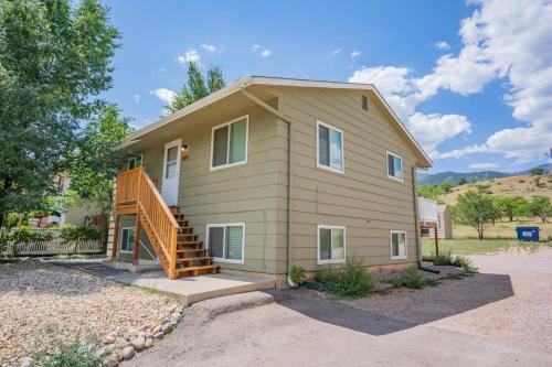 a house with a staircase in front of it at Romantic Getaway Base of Mountains Parks & Trails in Colorado Springs