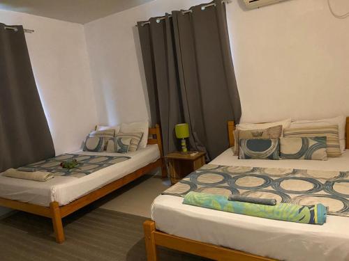 Cama o camas de una habitación en Le Kato Luxx