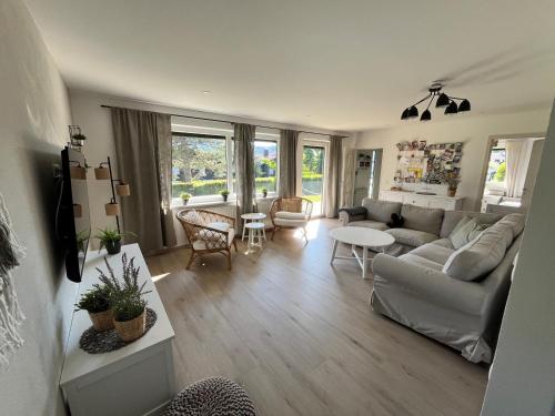 a living room with a couch and a table at FerienChata Bärenriegel in Arrach