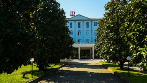 a blue building with a h on top of it at Bellavista Terme Resort & Spa in Montegrotto Terme