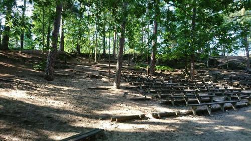 a group of benches in a park with trees at Apartmán U Růži in Sloup