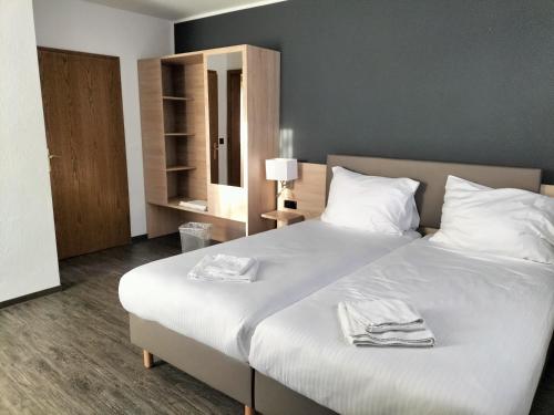 Postel nebo postele na pokoji v ubytování B3 Hotel