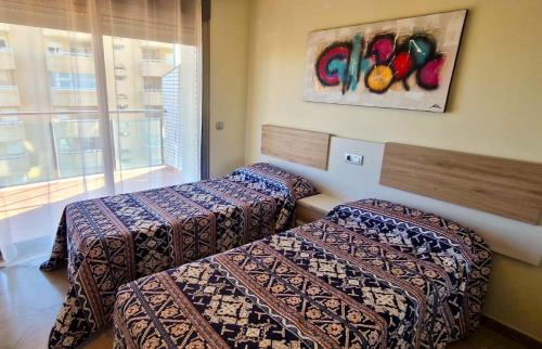A bed or beds in a room at Vila de Oropesa Nº1053