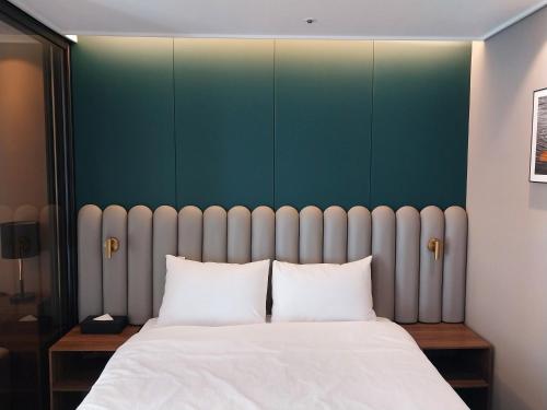 Katil atau katil-katil dalam bilik di The solid residence - Elbon the stay by haeundae