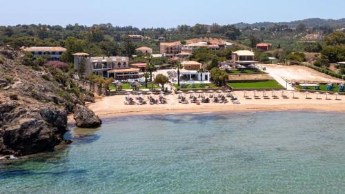 an aerial view of a beach with a resort at Plaka Beach Resort in Vasilikos