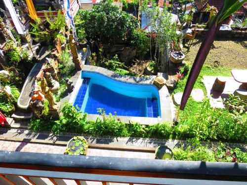 een model van een tuin met een zwembad bij Mountain View House in Kintamani