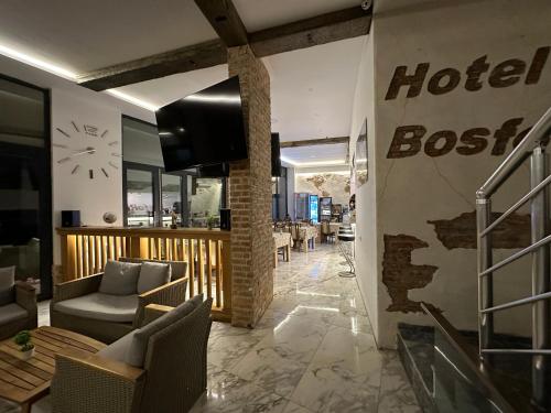 a lobby of a hotel with a hotelier sign on the wall at Bosfor Hotel in Dobra Voda