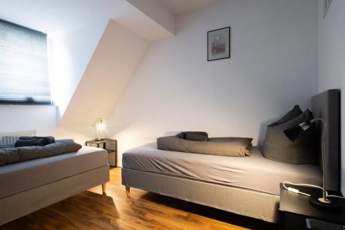 Ένα ή περισσότερα κρεβάτια σε δωμάτιο στο Stay & Work Apartment Gronau