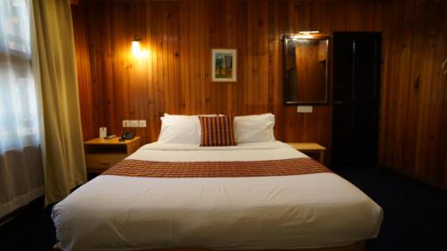 Ein Bett oder Betten in einem Zimmer der Unterkunft Hotel Olathang