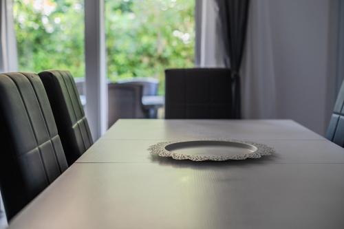 a table with a plate on top of it at Le Dune Verdi in Lido di Jesolo