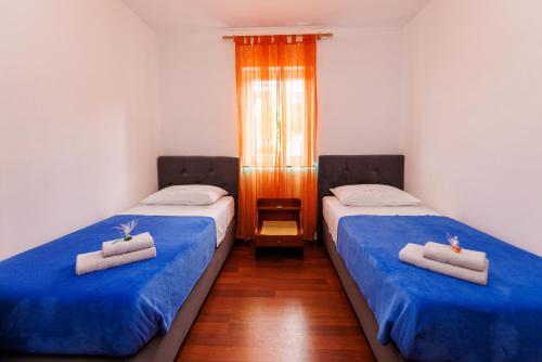 Postel nebo postele na pokoji v ubytování Apartments Stašić Katarina