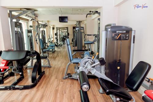a gym with several treadmills and exercise bikes at Rehana Plaza Hotel in Cairo