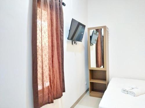 TV/trung tâm giải trí tại Ummi Home Syariah Mitra RedDoorz