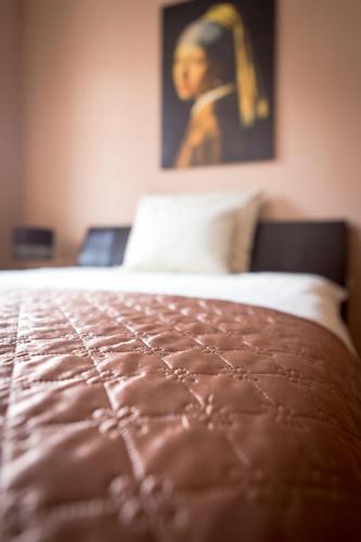 a close up of a bed in a bedroom at Villa Jeziorki 71 in Warsaw