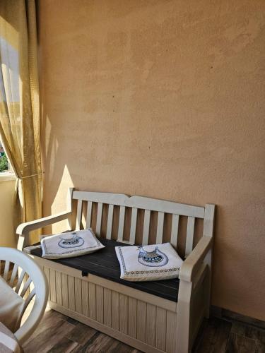 two towels are sitting on a bed in a room at S'Arrosa de Monti in Villaputzu
