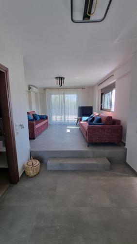 Ένα ή περισσότερα κρεβάτια σε δωμάτιο στο SanGerasimo Villas