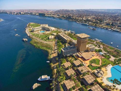 an aerial view of a resort on a island in the water at Mövenpick Resort Aswan in Aswan